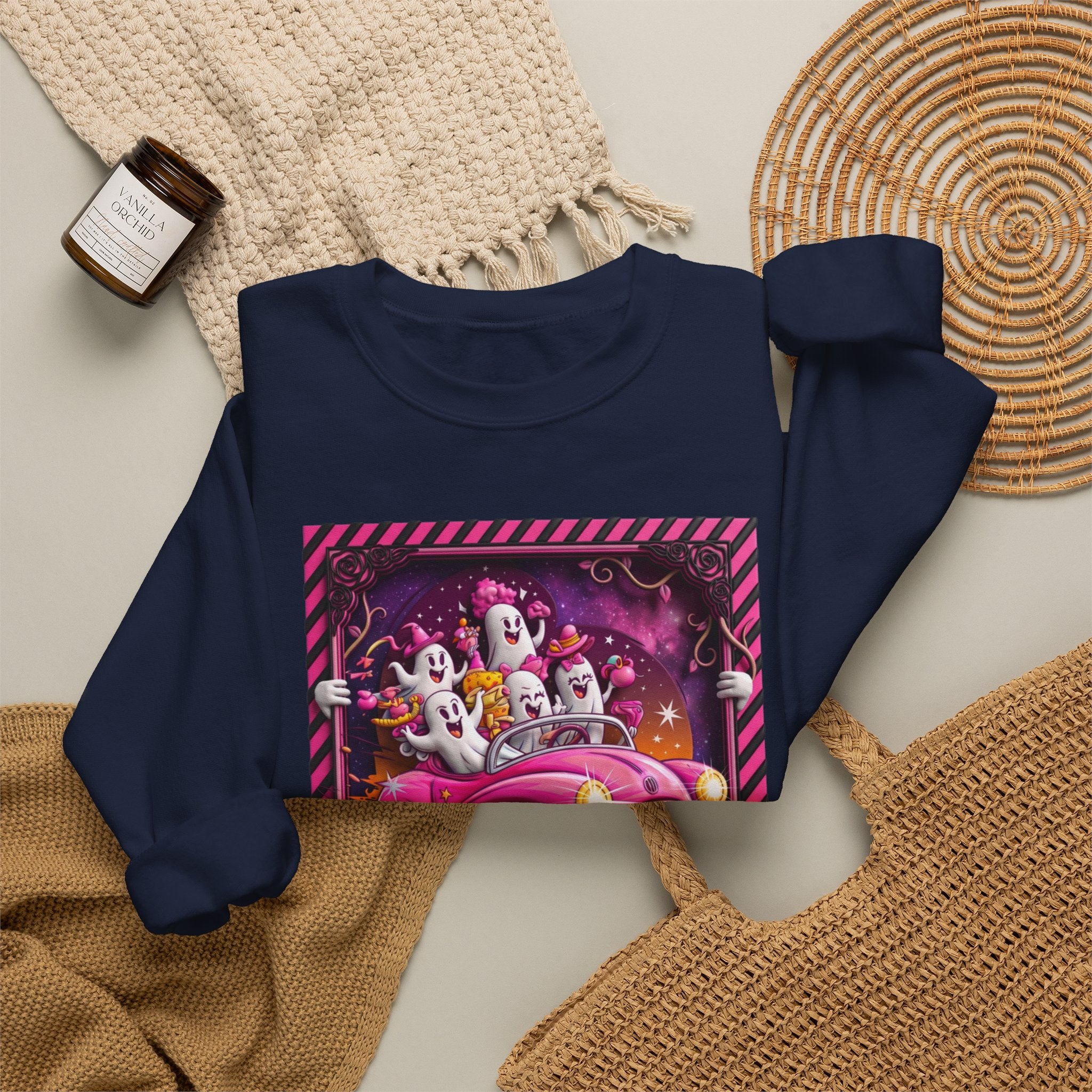 Navy crewneck sweatshirt styled flat with a candle — ghosts in a pink convertible