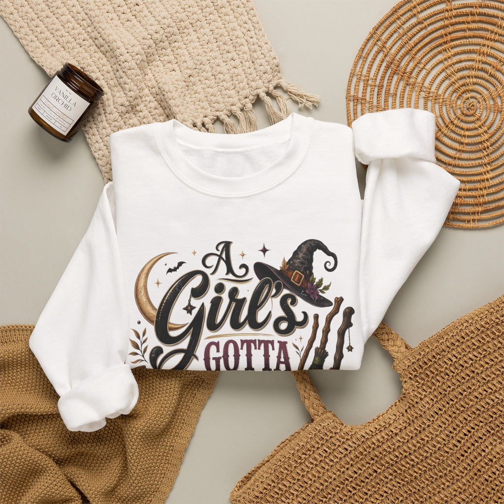 White crewneck sweatshirt styled flat with a candle — hand-lettered A Girl's Gotta Have Options