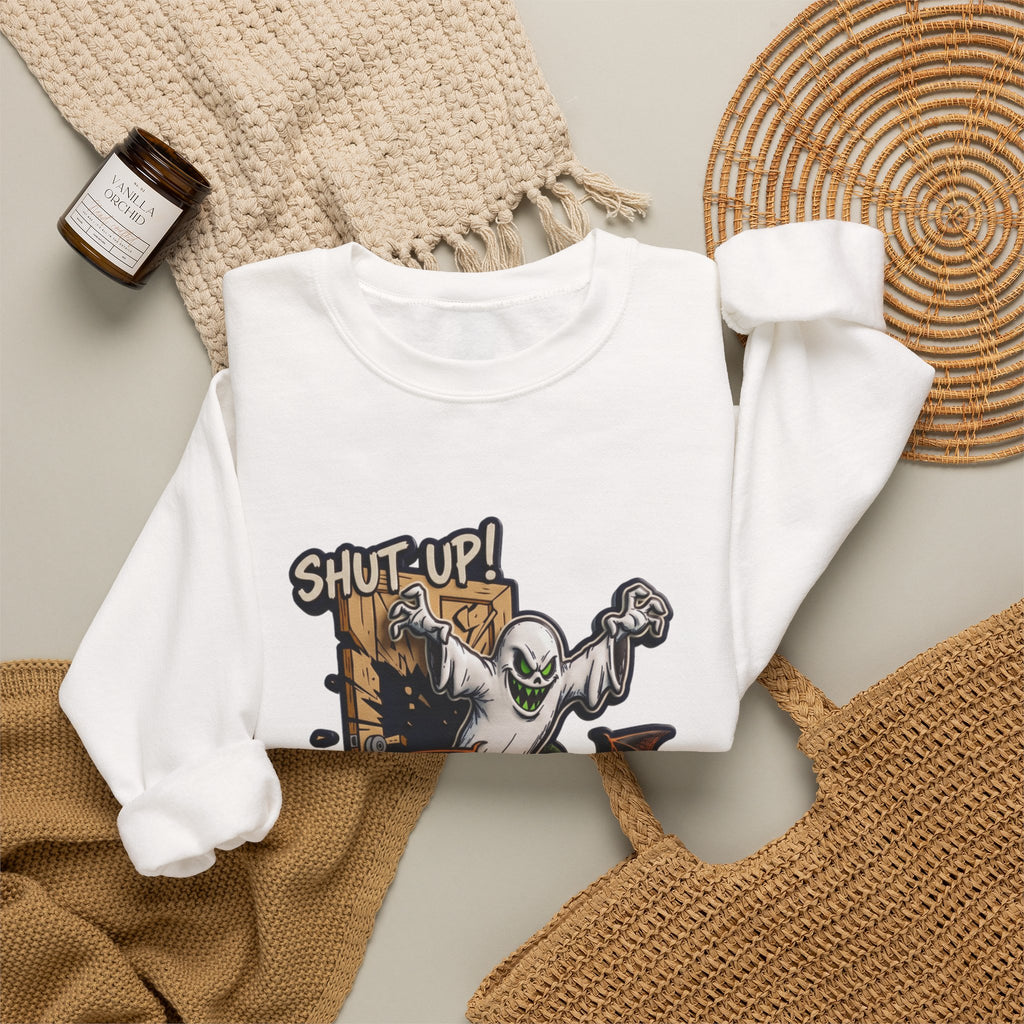 White crewneck sweatshirt styled flat with a candle — green-eyed ghost with bat wings