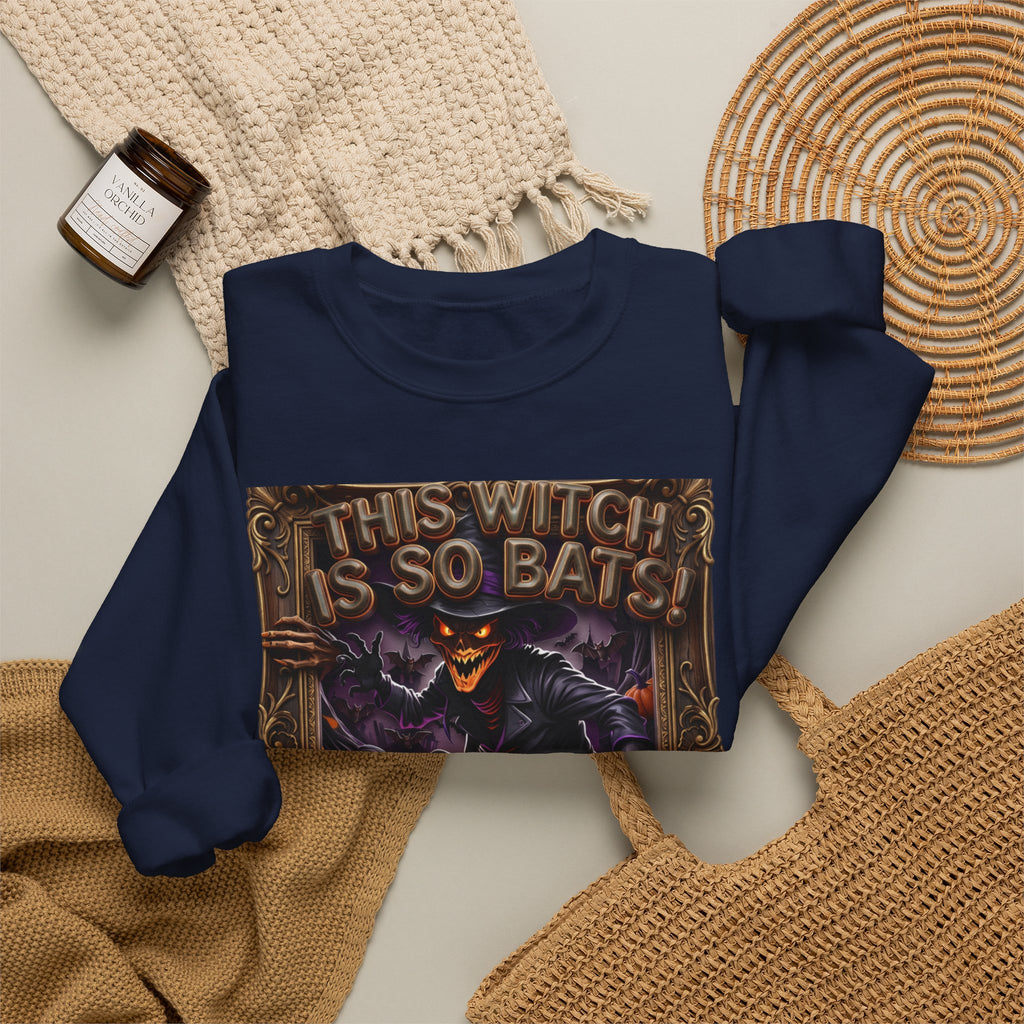 Navy crewneck sweatshirt styled flat with a candle — grinning witch in a pointed hat
