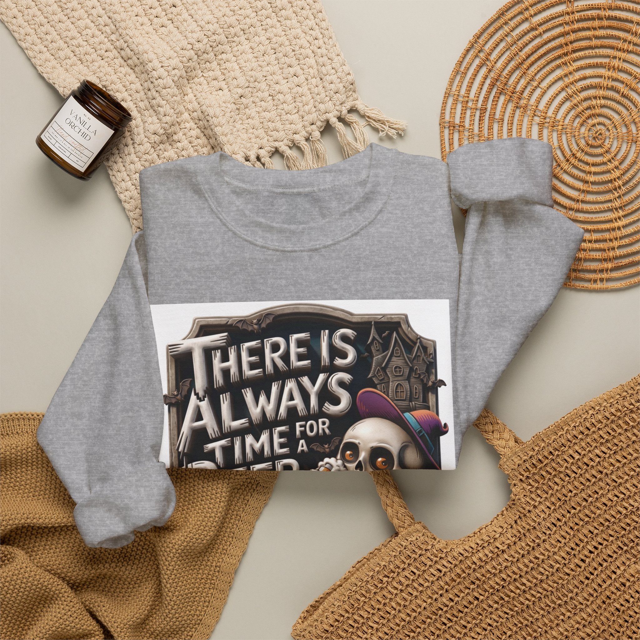 Sport Grey crewneck sweatshirt styled flat with a candle — skeleton in a floppy purple hat