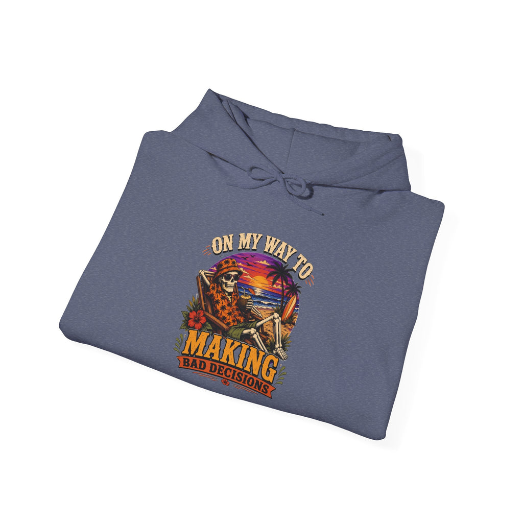 Heather Navy hoodie styled flat with a candle — sunset skeleton print