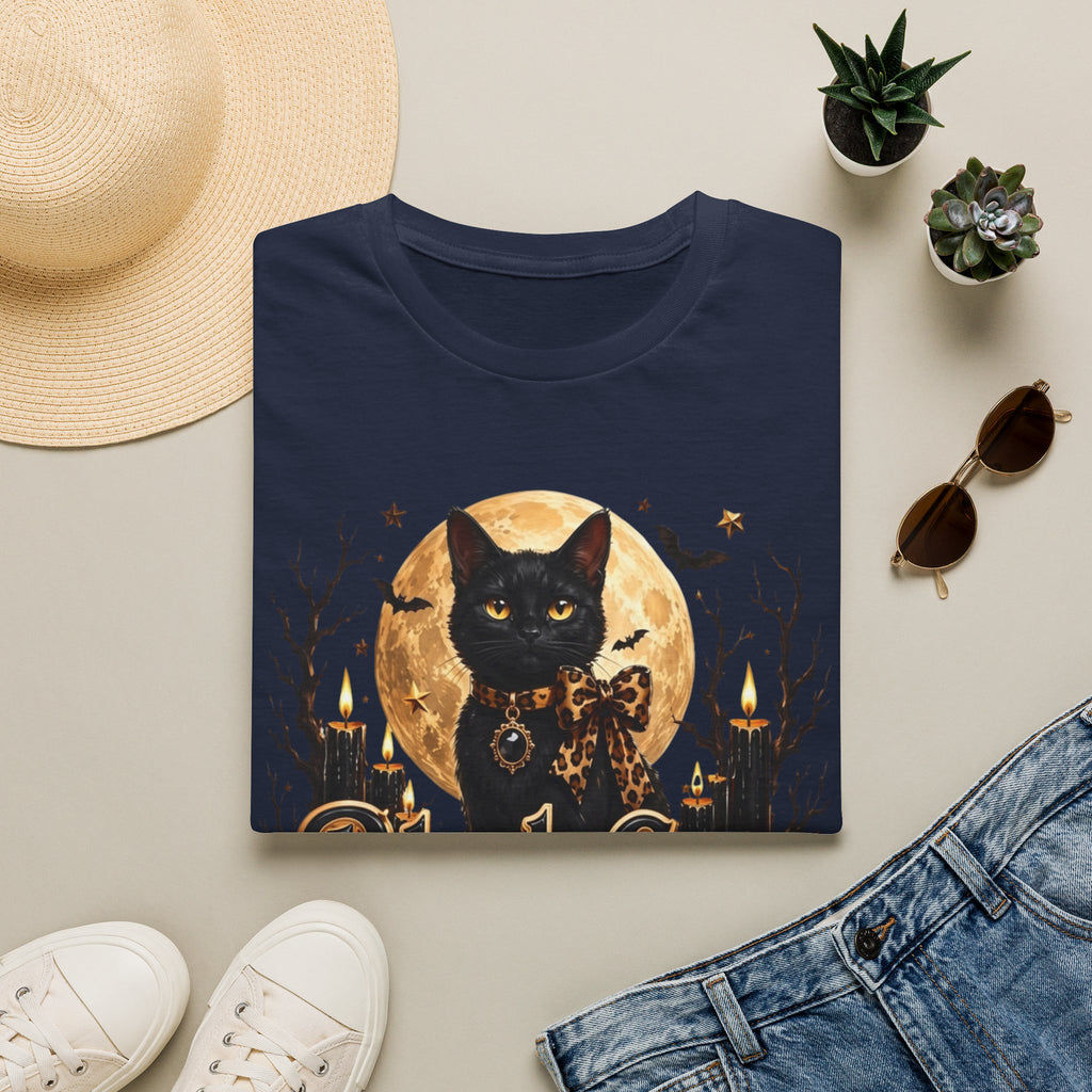 Navy t-shirt styled flat with a candle — black cat before a full moon