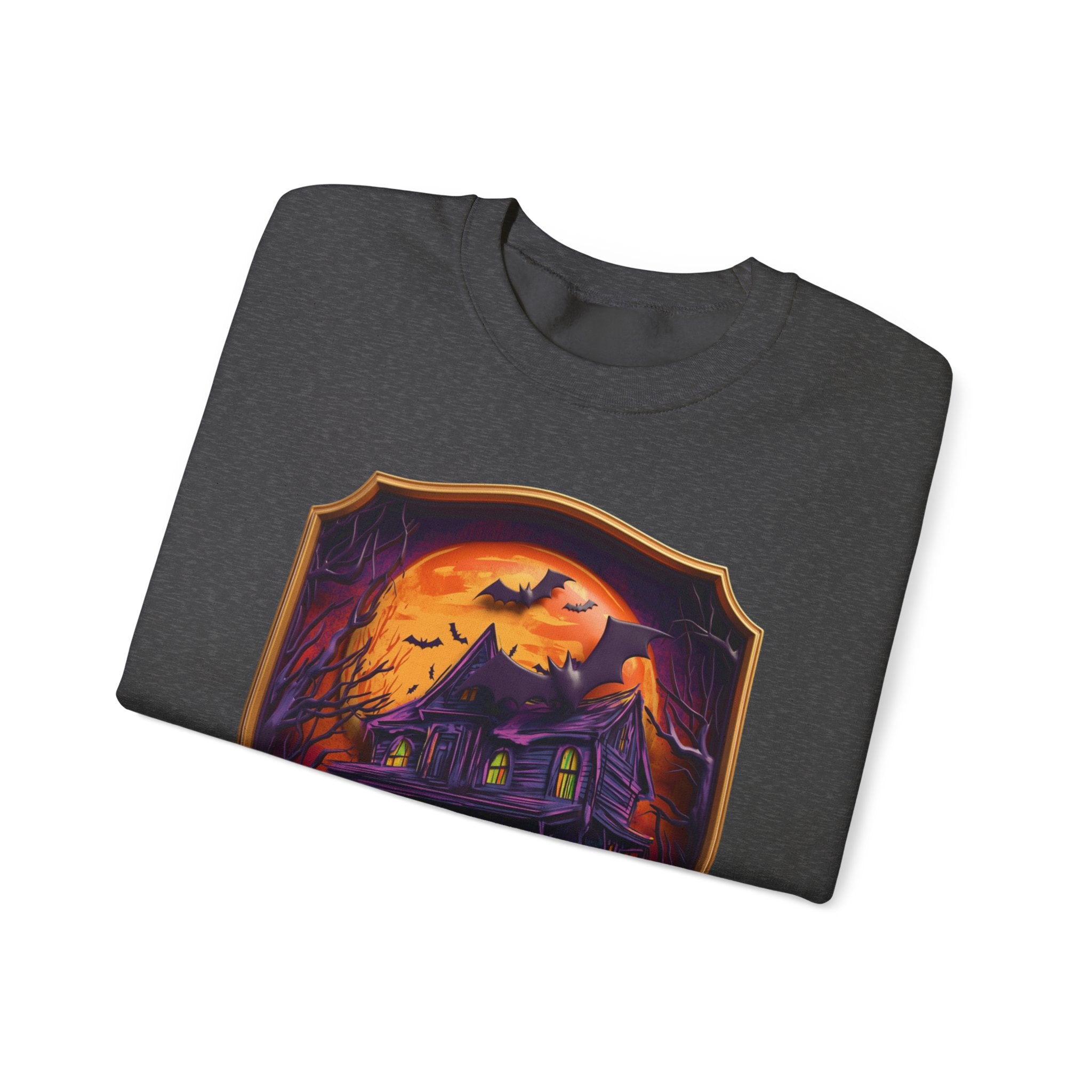 Dark Heather crewneck sweatshirt folded to show the purple haunted mansion sits under a blazing orange moon print