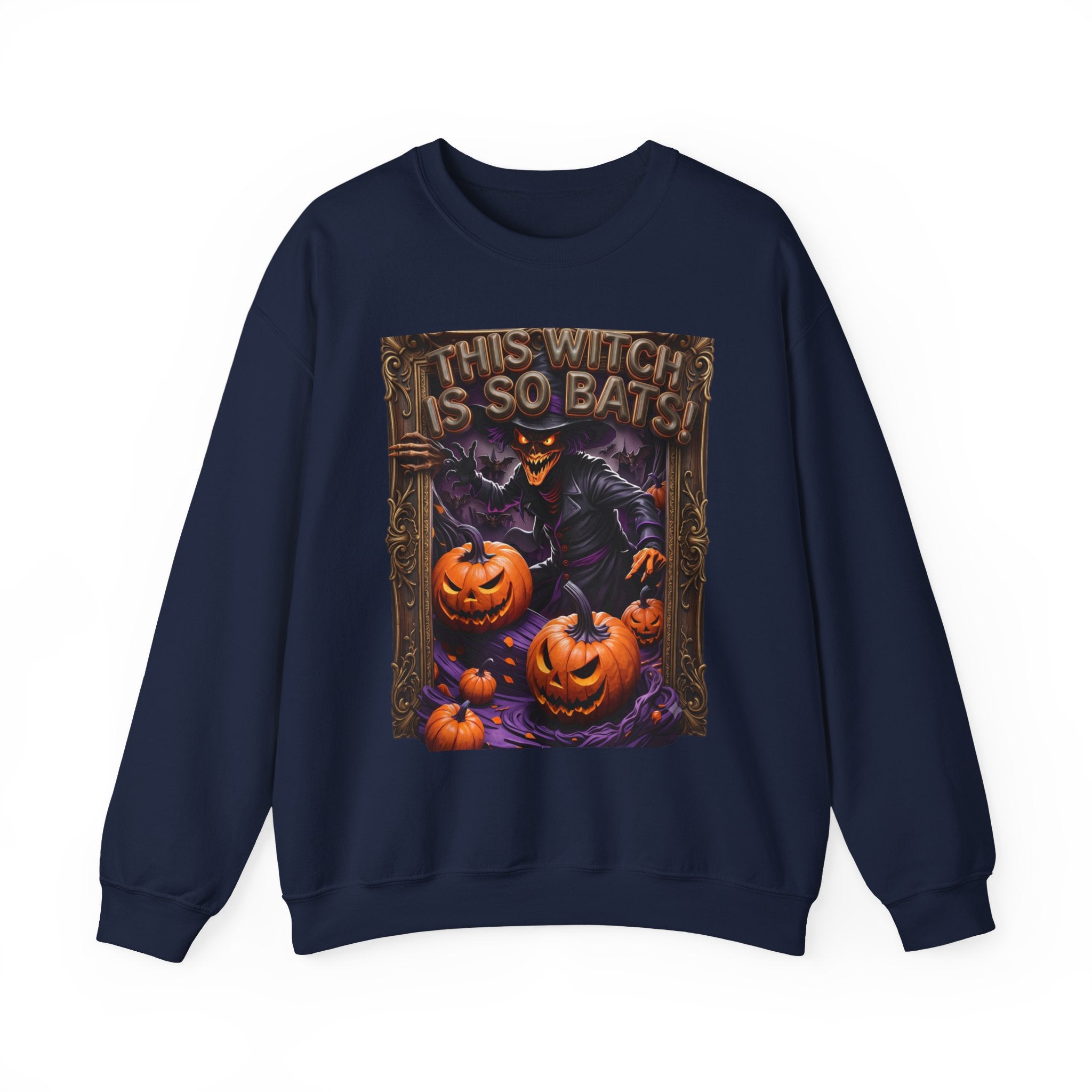 Navy crewneck sweatshirt laid flat, printed with a grinning witch in a pointed hat looms over glowing
